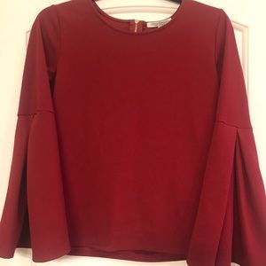 Red blouse with bell sleeves